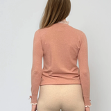 Pulover cu volan plisat roz