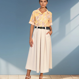 Fustă midi cu buzunare și pliuri crem