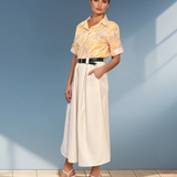 Fustă midi cu buzunare și pliuri crem