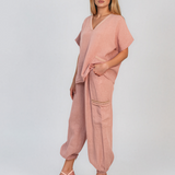 Pantaloni din in cu buzunare laterale și franjuri roz