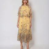 Rochie lungă din voal fluid cu volan jos și print floral galben